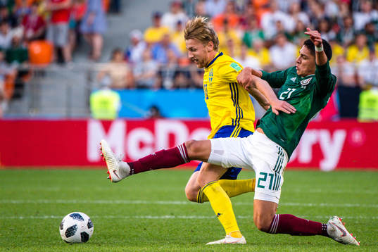 Emil Forsberg of Sweden and Edson Alvarez  of Mexico