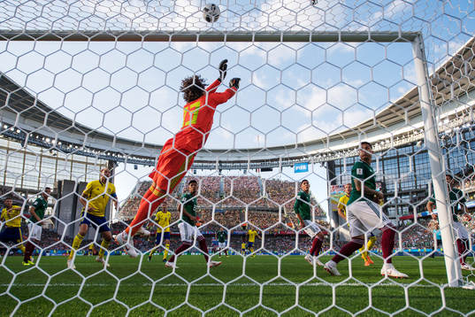 Goalkeeper Guillermo Ochoa of Mexico reaches for the ball