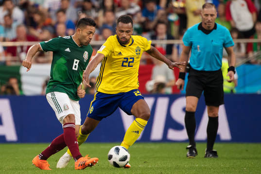 Marco Fabian of Mexico and Isaac Kiese Thelin of Sweden