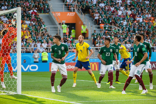goalkeeper Guillermo Ochoa of Mexico  with a save  in front