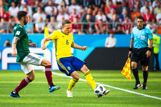 Miguel Layun of Mexico and Ludwig Augustinsson of Sweden