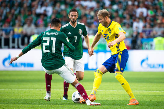 Ola Toivonen of Sweden against Edson Alvarez and Miguel