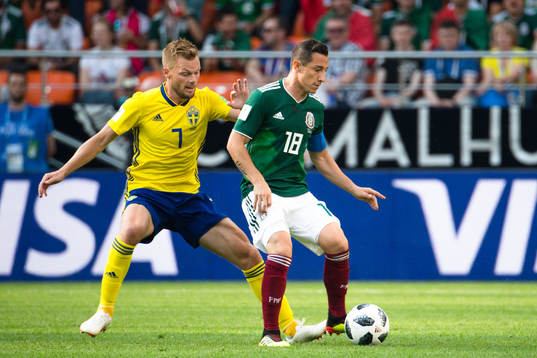 Sebastian Larsson of Sweden and Andres Guardado  of Mexico