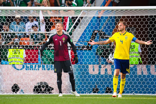 goalkeeper Robin Olsen and Andreas Granqvist of Sweden