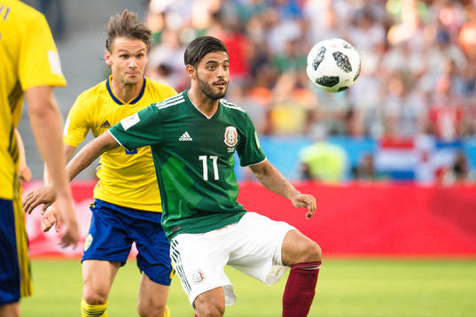 Albin Ekdal of Sweden and Carlos Vela  of Mexico