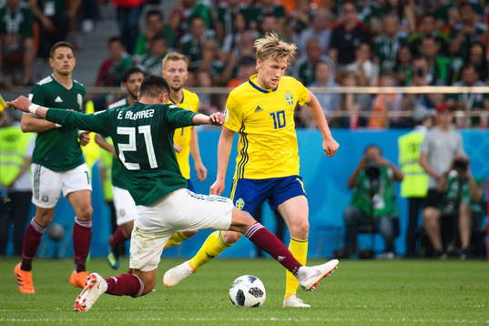 Edson Alvarez  of Mexico and Emil Forsberg of Sweden