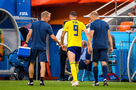Marcus Berg of Sweden leaves the pitch with a injury
