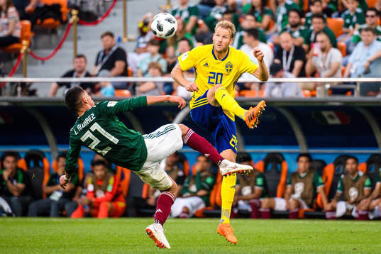 Edson Alvarez of Mexico and Ola Toivonen of Sweden
