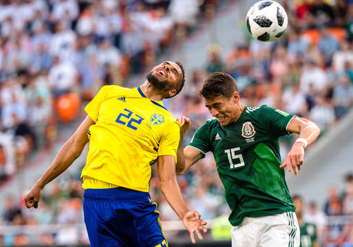 Isaac Kiese Thelin of Sweden and Hector Moreno of Mexico
