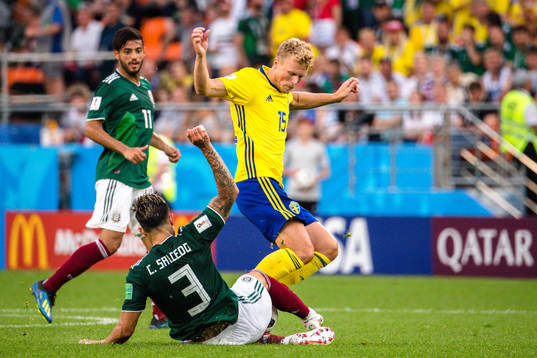 Carlos Salcedo of Mexico and Oscar Hiljemark of Sweden