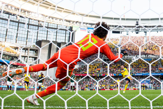 Andreas Granqvist of Sweden scores 0-2 from the penalty