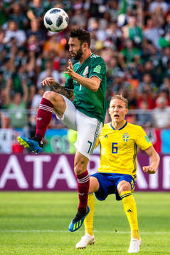 Miguel Layun of Mexico and Ludwig Augustinsson of Sweden
