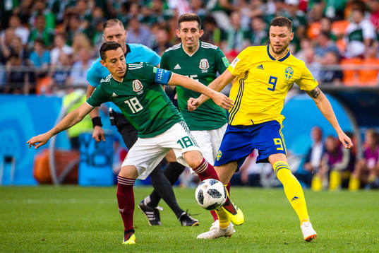 Andres Guardado of Mexico and Marcus Berg of Sweden