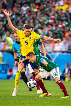 Andres Guardado of Mexico and Marcus Berg of Sweden