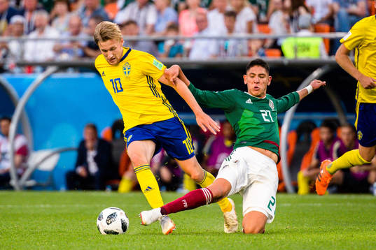 Emil Forsberg of Sweden and Edson Alvarez of Mexico