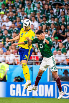 Marcus Berg of Sweden and Edson Alvarez of Mexico