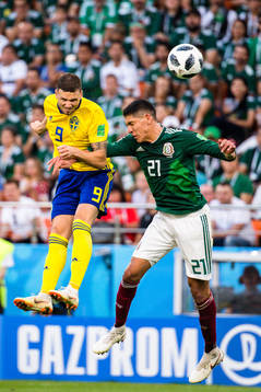Marcus Berg of Sweden and Edson Alvarez of Mexico