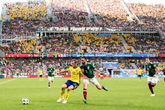 Viktor Claesson of Sweden and Miguel Layun of Mexico