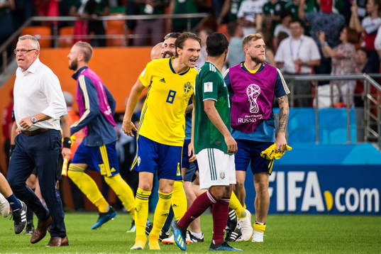 Albin Ekdal of Sweden heckle Carlos Vela of Mexico