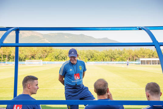 Head coach Janne Andersson talks to players of the Swedish