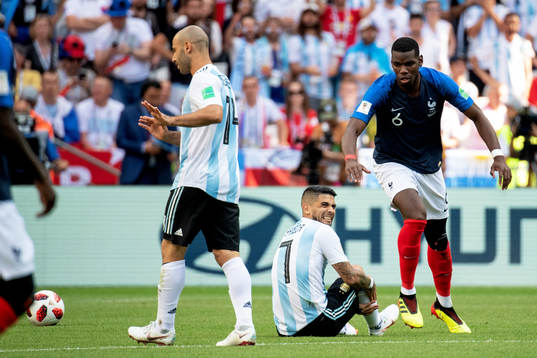 Paul Pogba of France and Ever Banega of Argentina