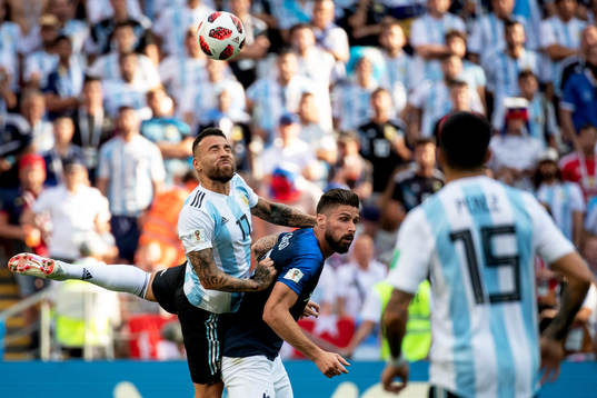 Nicolas Otamendi of Argentina and Olivier Giroud of France