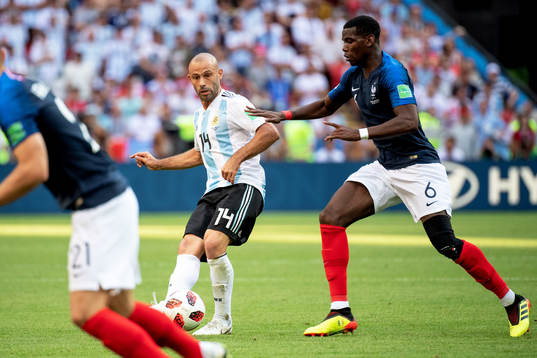 Javier Mascherano of Argentina and Paul Pogba of France