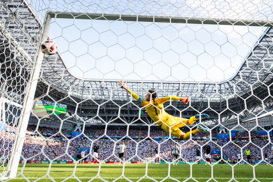 Angel Di Maria of Argentina scores 1-1 behind goalkeeper