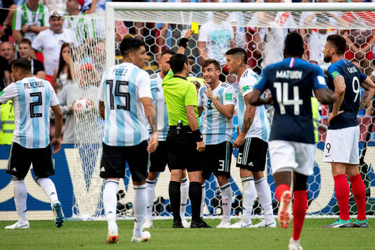Nicolas Tagliafico of Argentina gets yellow card