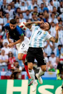 Olivier Giroud of France and Nicolas Otamendi of Argentina