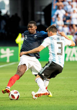 Paul Pogba of France and Nicolas Tagliafico of Argentina