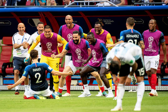 Benjamin Pavard of France celebrates with his teammates