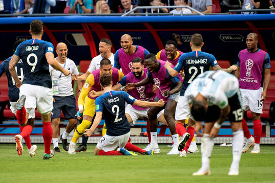 Benjamin Pavard of France celebrates with his teammates
