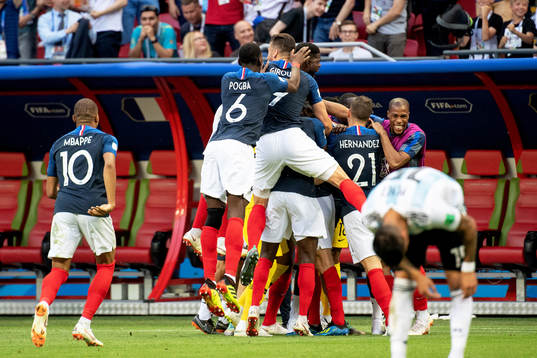 Benjamin Pavard of France celebrates with his teammates