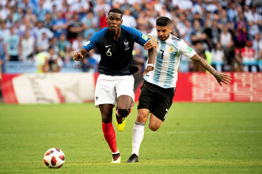 Paul Pogba of France and Ever Banega of Argentina