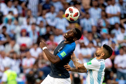 Paul Pogba of France and Ever Banega of Argentina