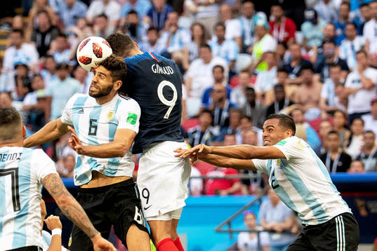 Federico Fazio of Argentina and Olivier Giroud of France