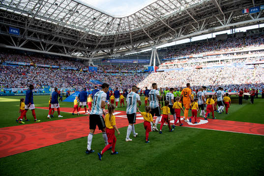Teams enter the pitch befors the FIFA World Cup round of 16
