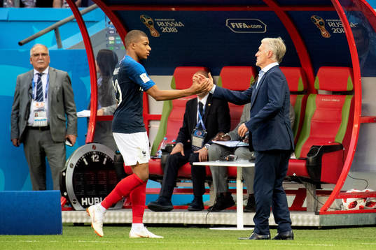 Kylian Mbappe and head coach Didier Deschamps of France