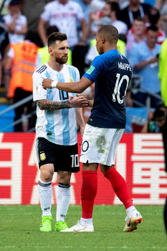 Lionel Messi of Argentina and Kylian Mbappe of France