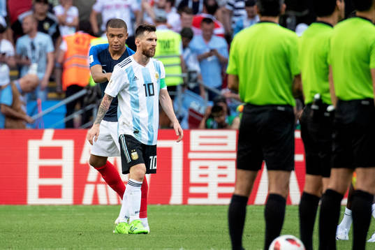 Lionel Messi of Argentina and Kylian Mbappe of France