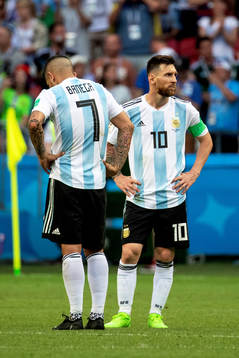 Ever Banega and Lionel Messi of Argentina looks dejected