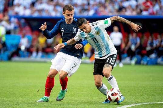 Antoine Griezmann of France and Angel Di Maria of Argentina