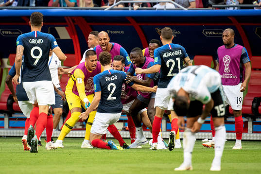 Benjamin Pavard of France celebrates with his teammates