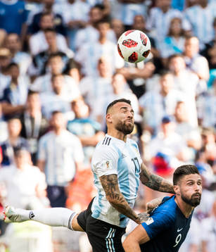 Nicolas Otamendi of Argentina and Olivier Giroud of France
