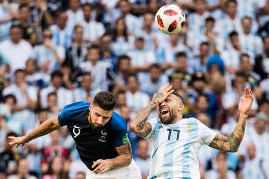 Olivier Giroud of France and Nicolas Otamendi of Argentina