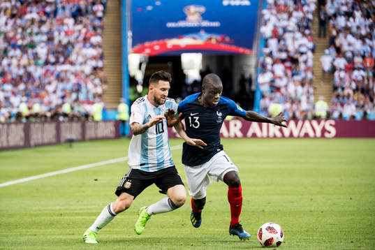 Lionel Messi of Argentina in action with Ngolo Kante of