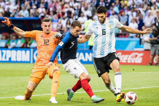 Antoine Griezmann of France in action with goalkeeper