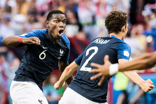 Paul Pogba celebrates with Benjamin Pavard of France