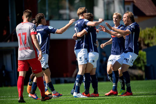 Kristian Thorstvedt of Viking celebrates with his teammates